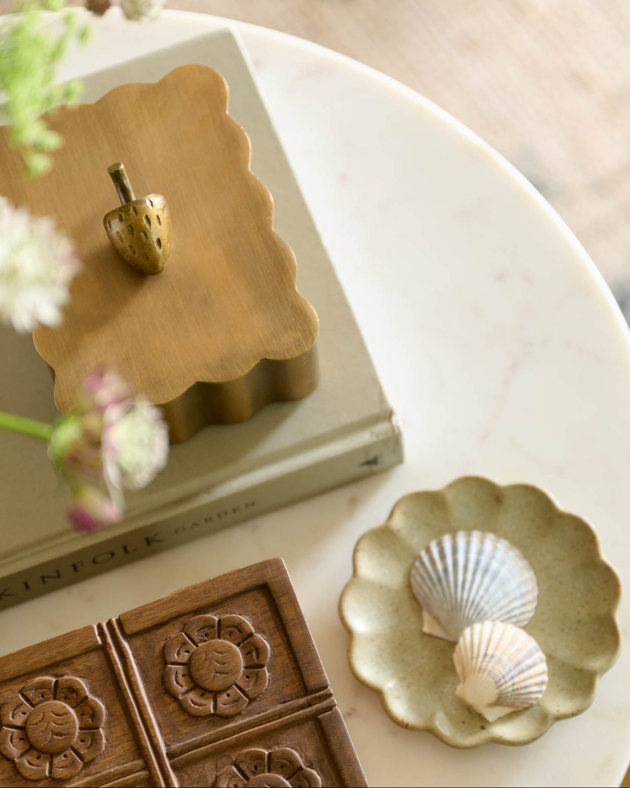 Antiqued Brass Scalloped Box Small on top of book