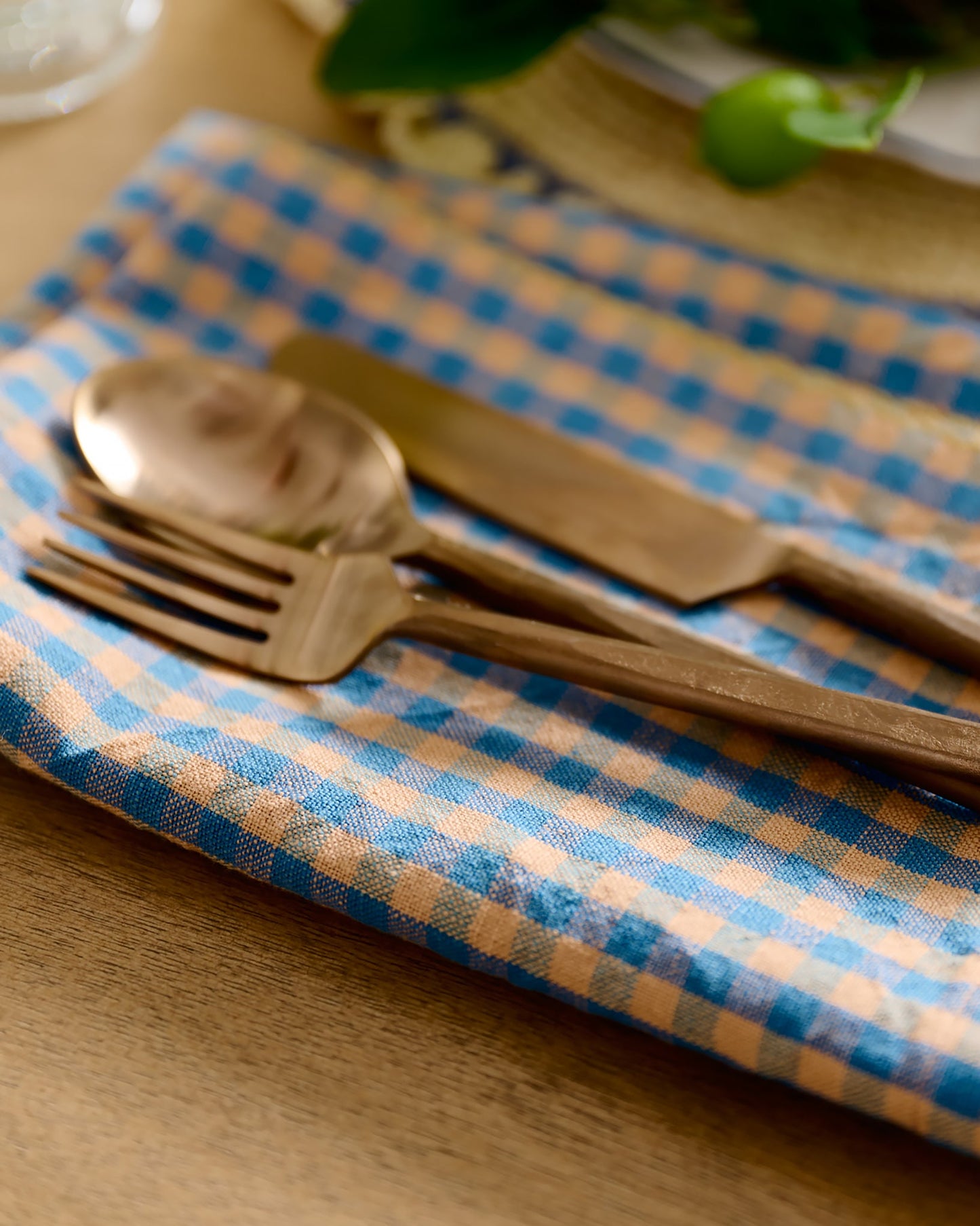 Poolside Check Napkin Set of 4 with copper silverware on top 