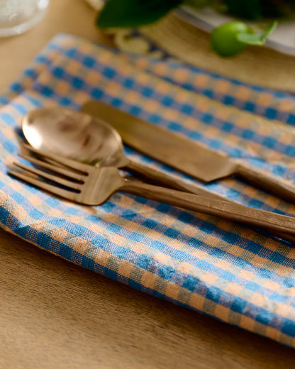 Poolside Check Napkin Set of 4 with copper silverware on top 