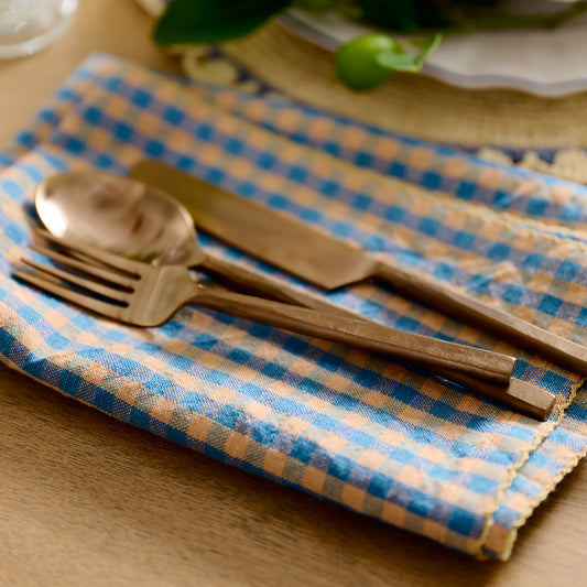 Poolside Check Napkin Set of 4 with copper silverware on top 