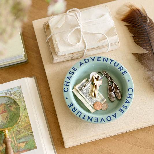 Chase Adventure Decorative Trinket Dish on top decorative book with money and keys inside dish