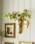 Theresa Wall Mounted Solid Brass Vase with florals inside on wall