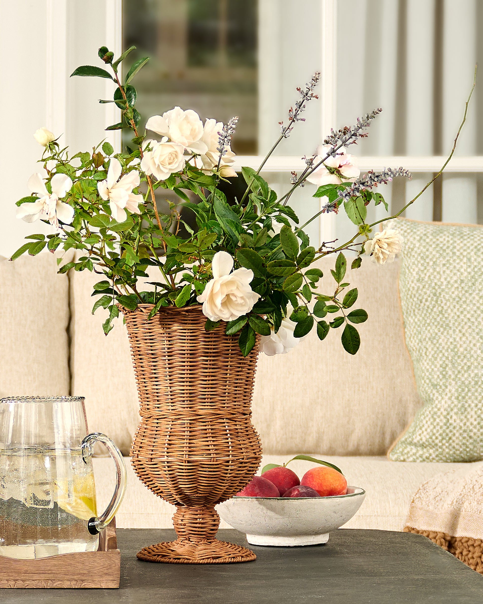 Woven Rattan Footed Vessel with flowers 