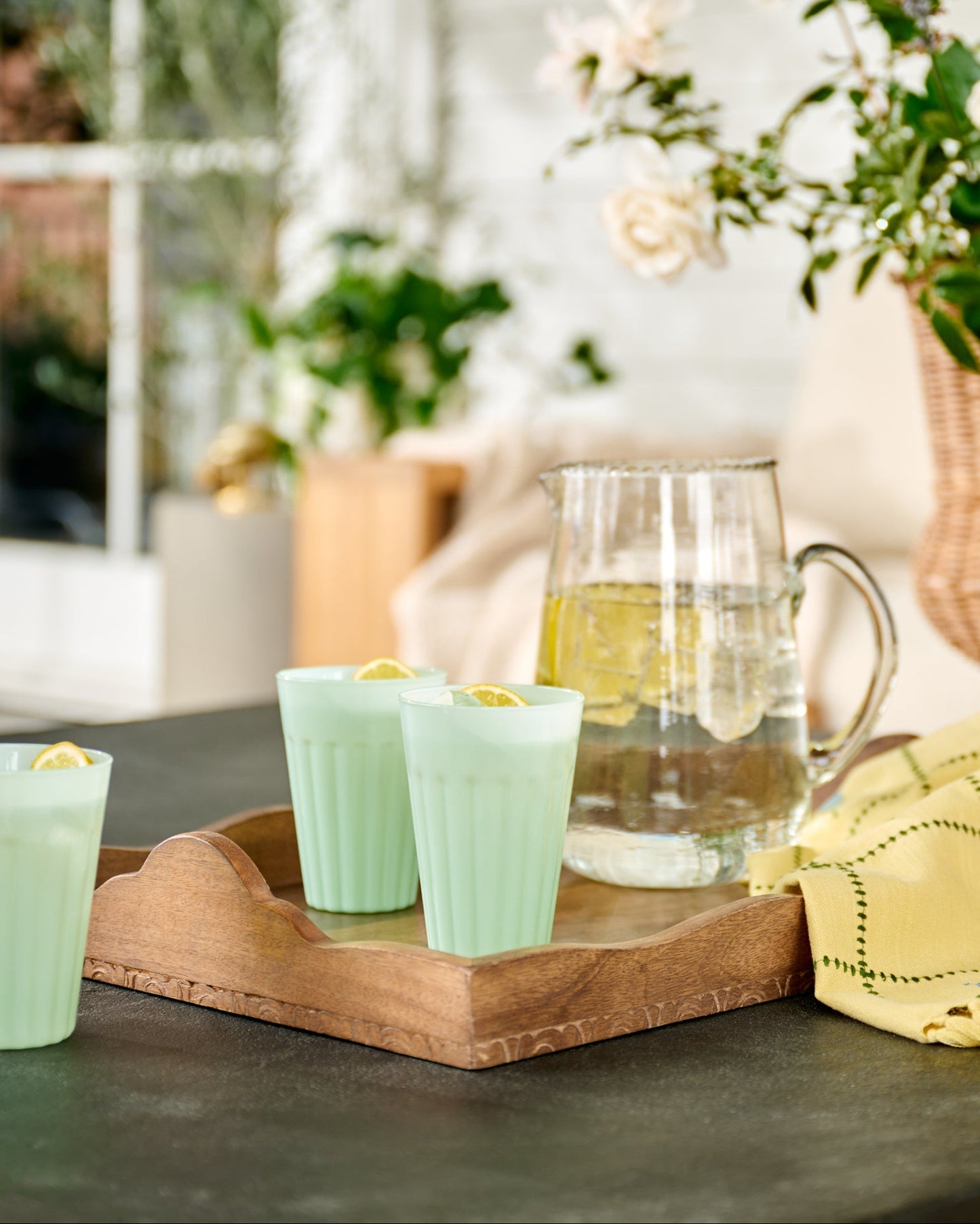 Light Green Milk Glass Tumbler on outdoor patio and wood tray