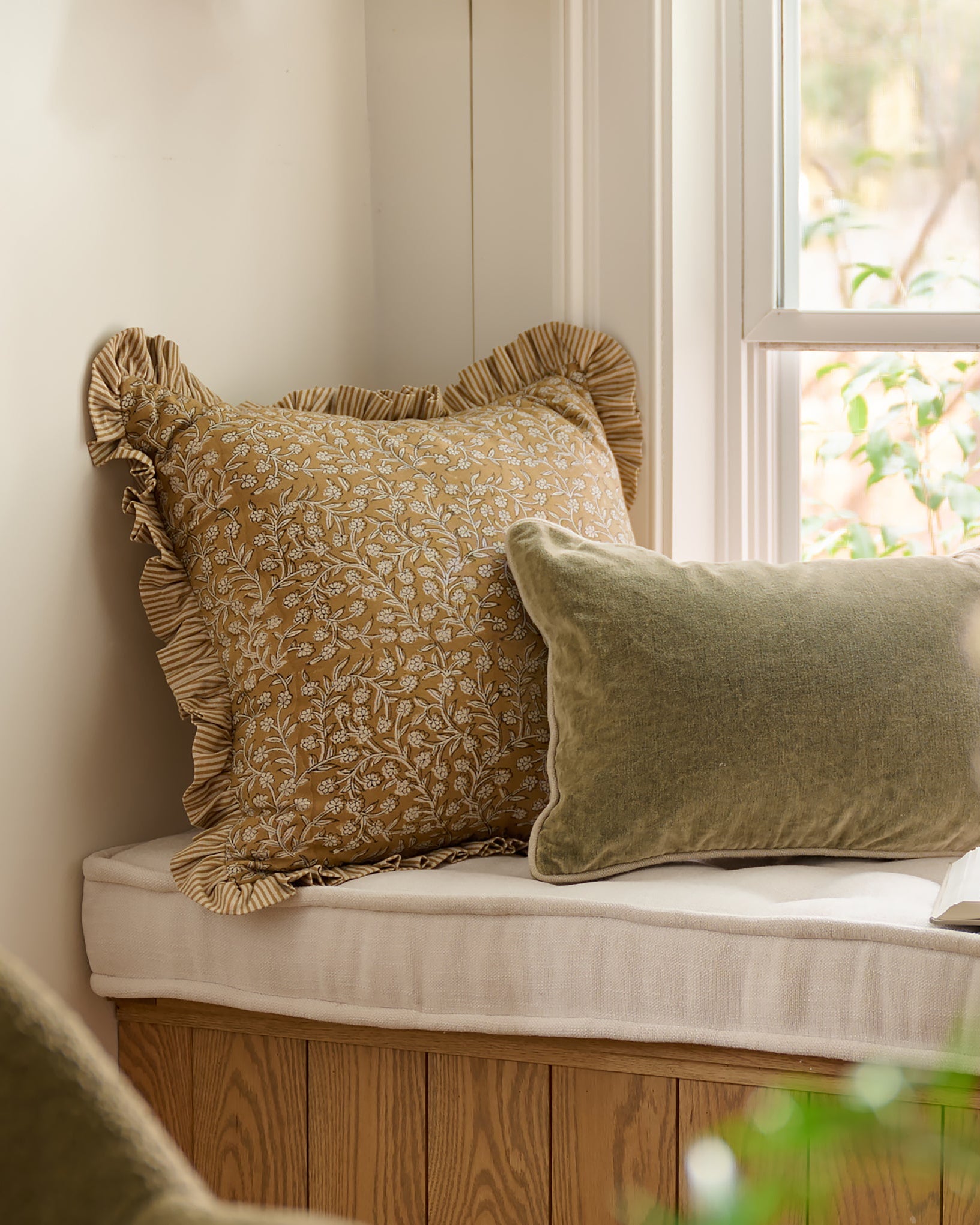 Maggie Ruffle Edge Floral Block Print Pillow on reading bench