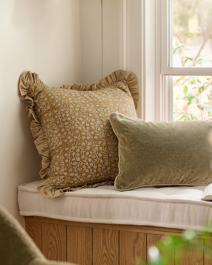 Maggie Ruffle Edge Floral Block Print Pillow on reading bench