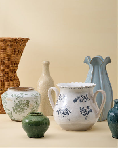 Cream Crackle Bottle Vase shown with other vases