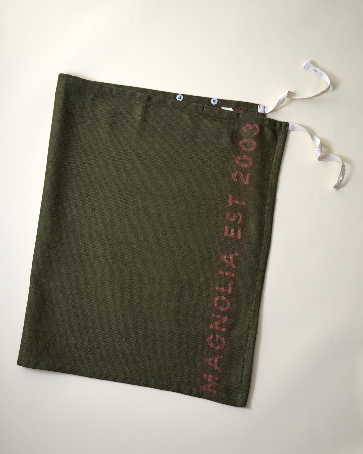 Magnolia Est. Convertible Tea Towel Apron - Capers flat lay