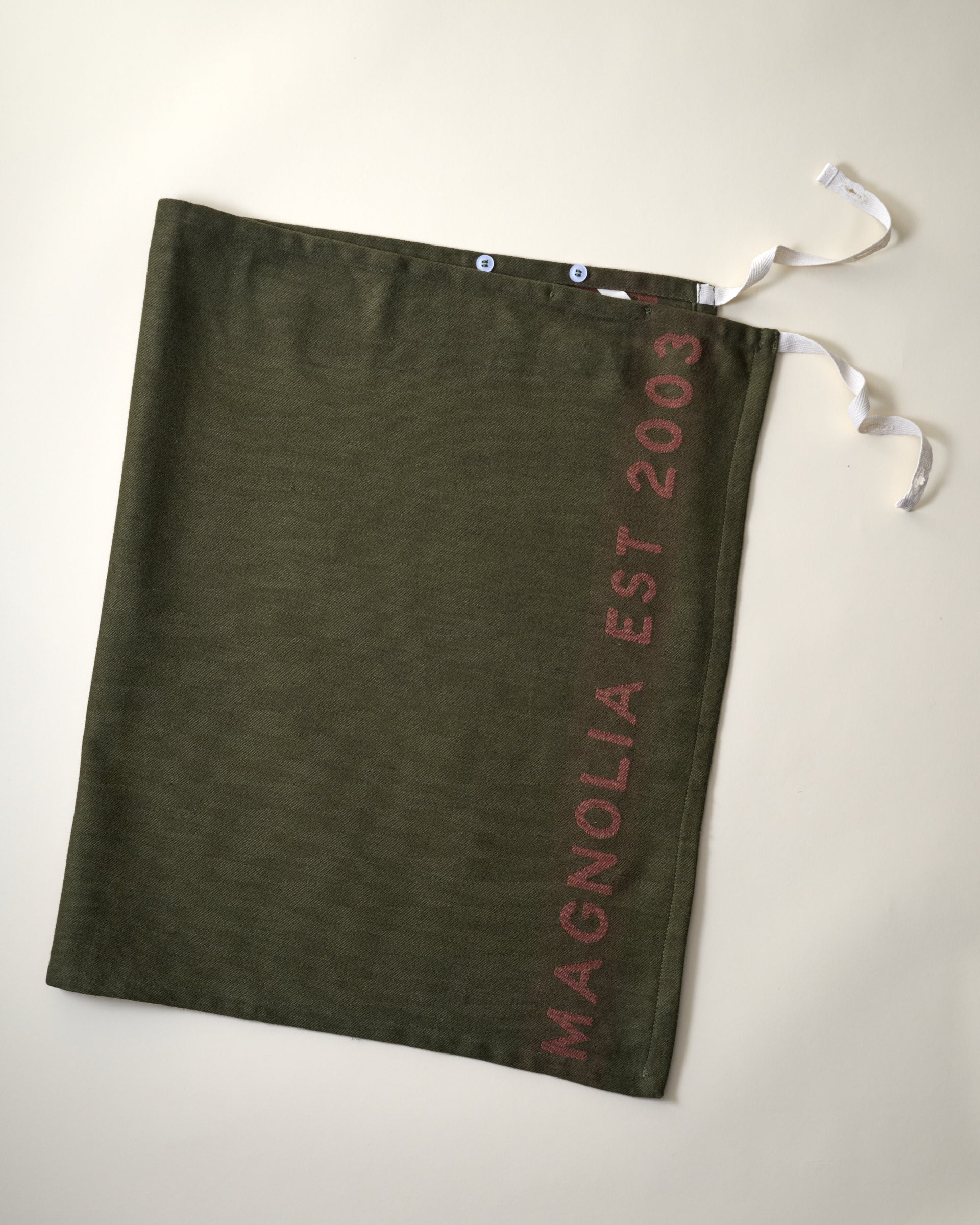 Magnolia Est. Convertible Tea Towel Apron - Capers flat lay