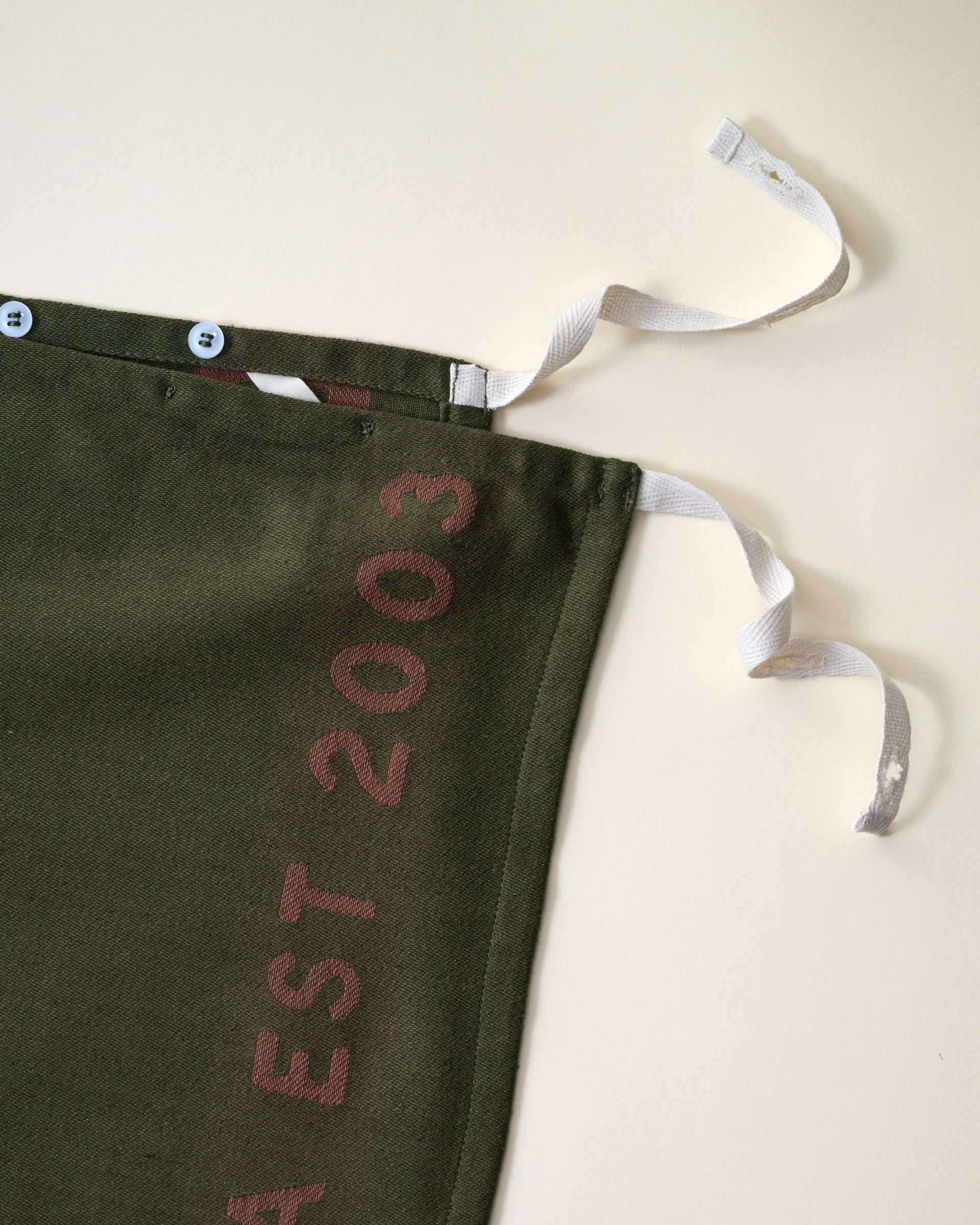 Magnolia Est. Convertible Tea Towel Apron - Capers close up ties