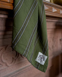Olive Herringbone Stripe Tea Towel close up hanging off mantel