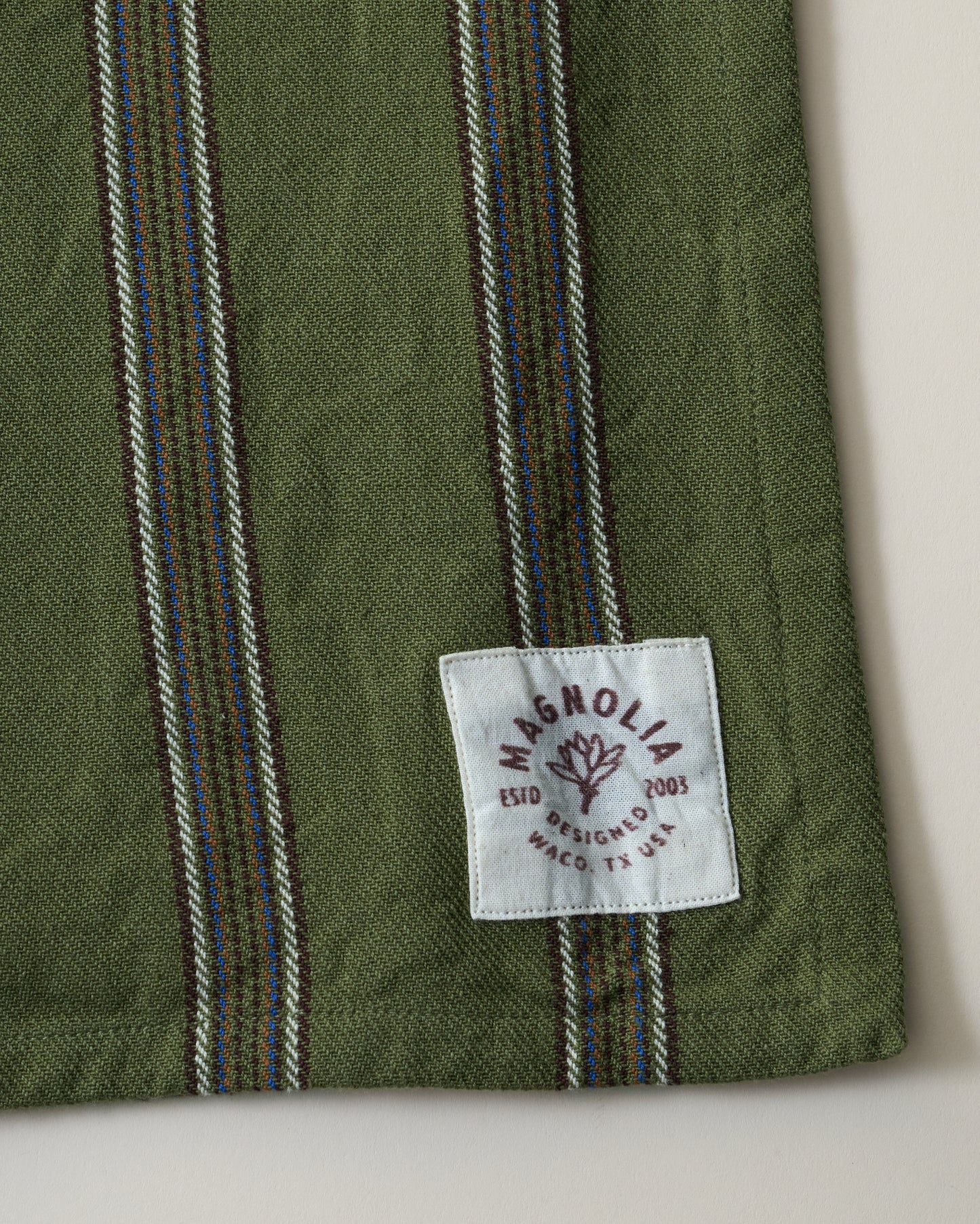 Olive Herringbone Stripe Tea Towel close up logo and stripe pattern