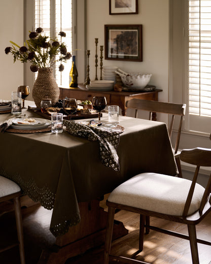 Olive Green Scalloped Eyelet Tablecloth placed on table 
