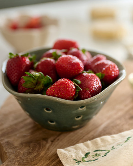 Ceramic Berry Bowl in Green with strawberries in kitchen