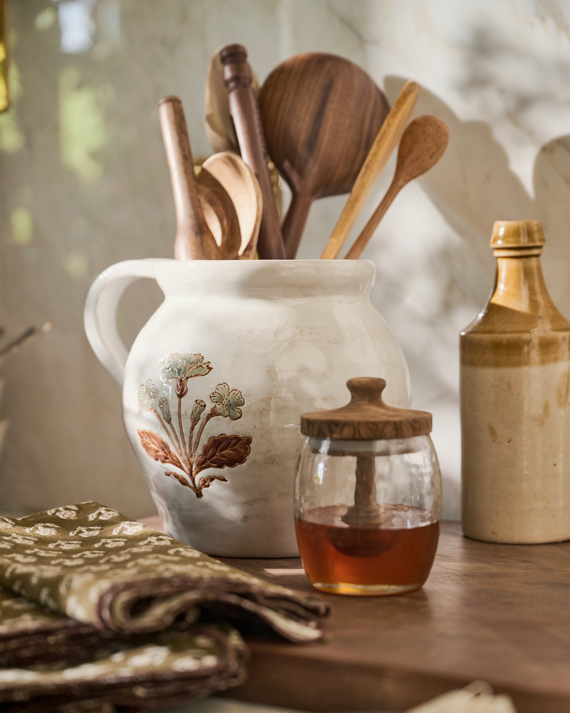 Elaine Floral Pitcher Crock with utensils inside next to honey jar