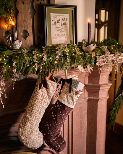 Crewel Embroidered Floral Stocking in Winter White in a room