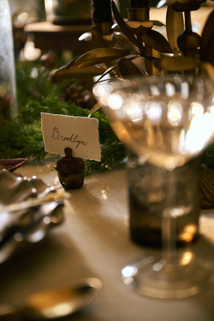 Acorn Jingle Bell Place Card Holder at a place setting