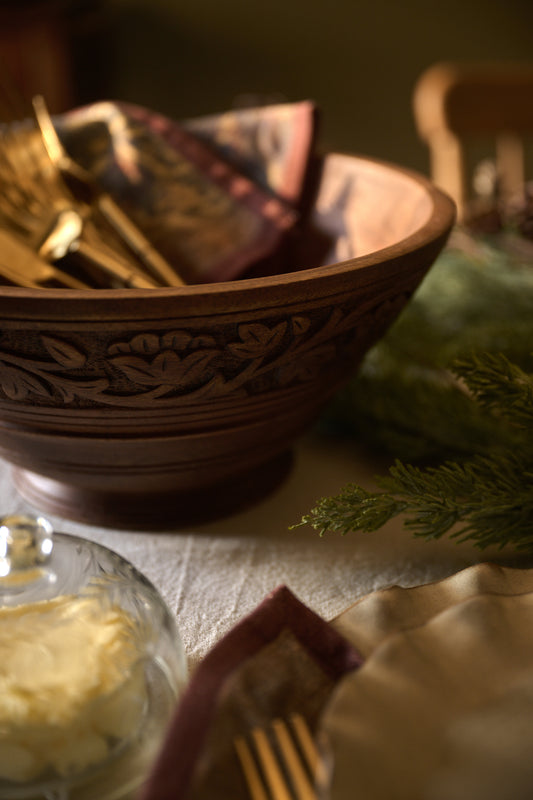 Oversized Hand-Carved Wood Bowl on a dining table