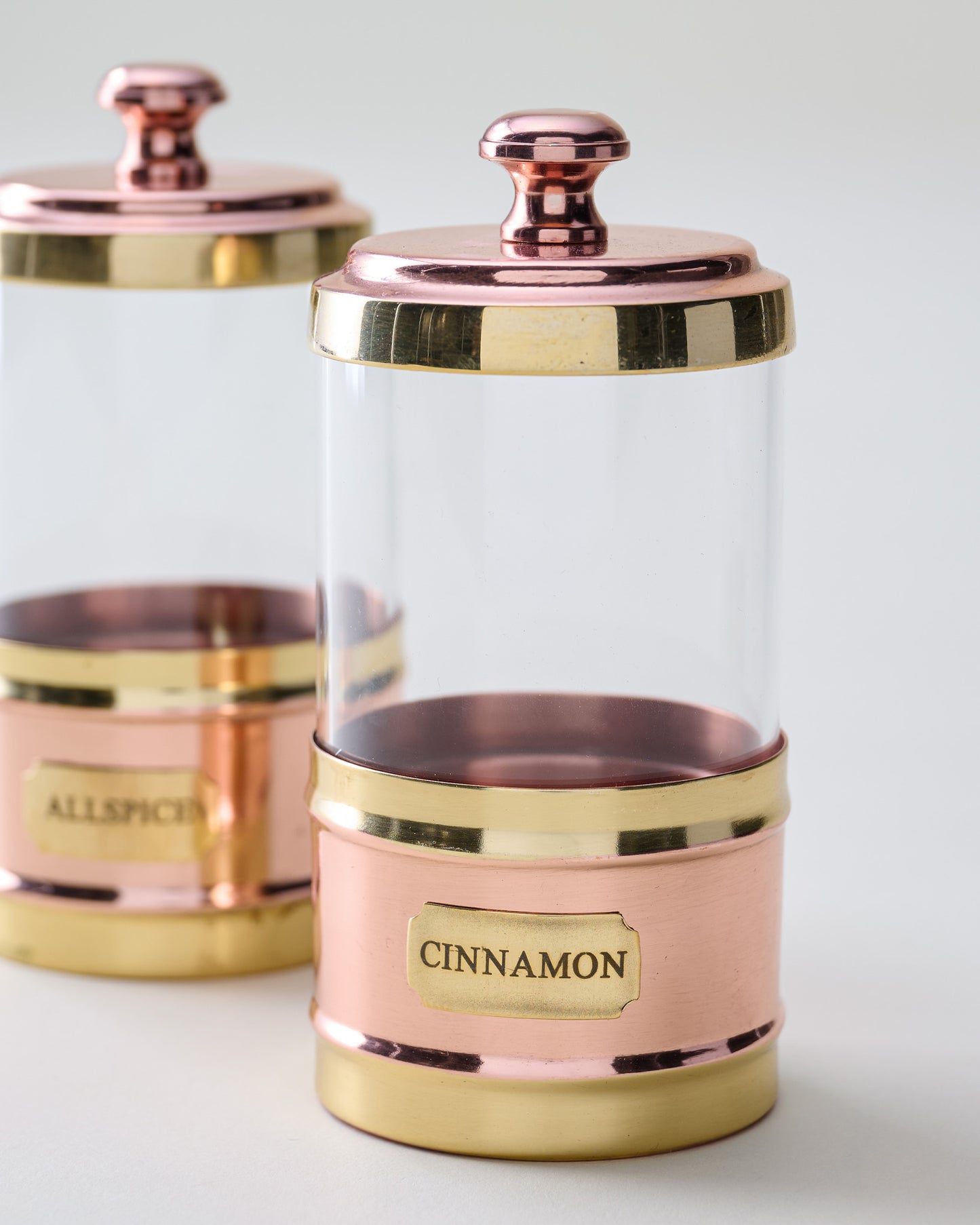 Antique Copper and Glass Spice Jars Set of Four close up of cinnamon