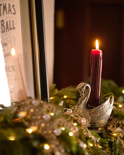 Antique Inspired Pewter Swan Taper Holder in a room