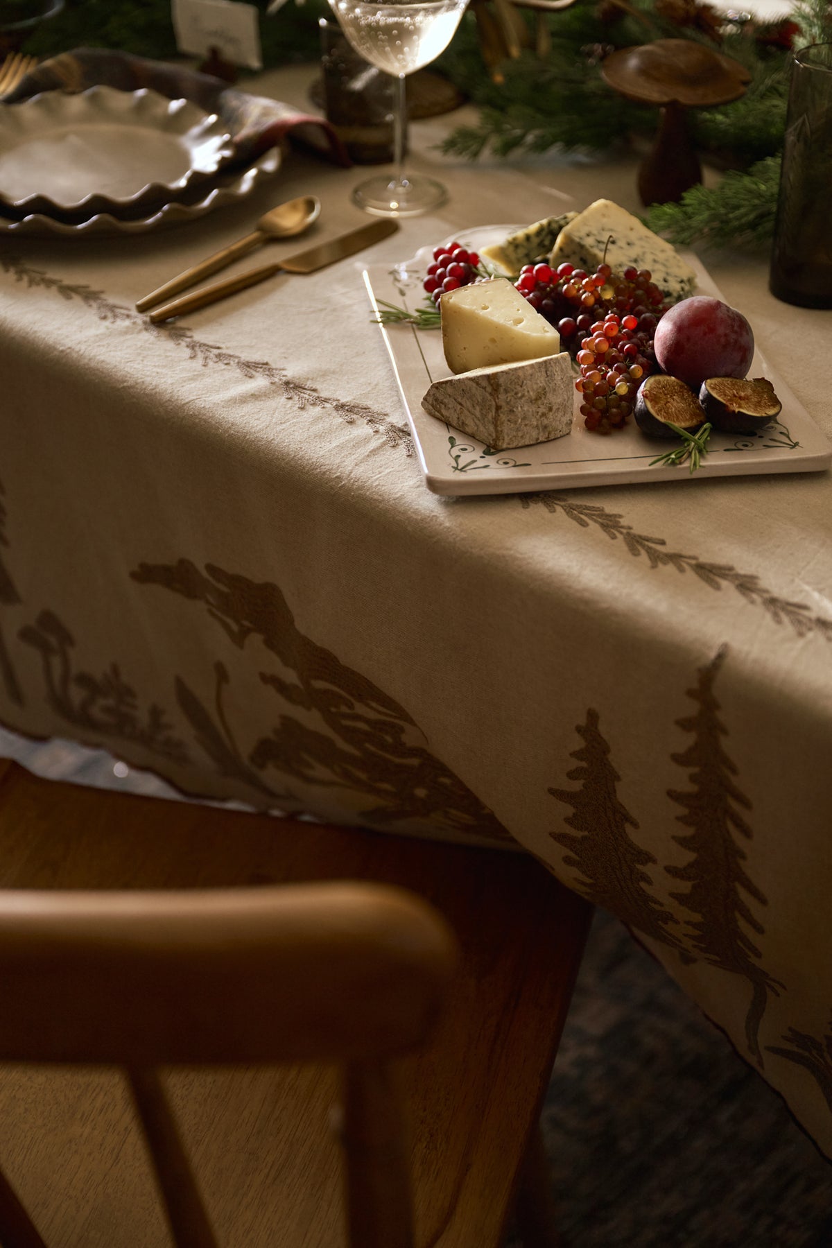 Crewel Embroidered Scalloped Tablecloth - 108"x70" on a table