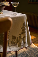 Crewel Embroidered Scalloped Tablecloth - 108"x70" on a table