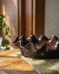 Chocolate Scalloped Pie Dish on top of tea towel