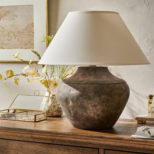 Valencia Table Lamp on a dresser next to a vase with florals