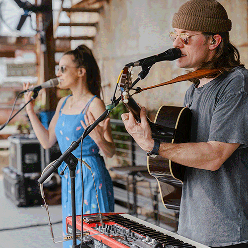 GIF of musicians, artists and vendors.