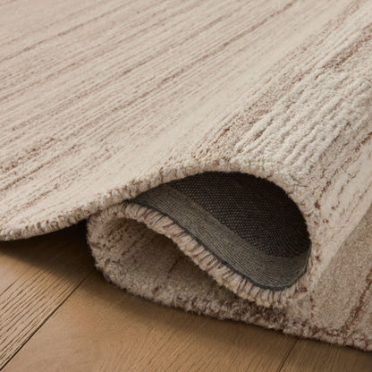 Rae Natural Oatmeal Rug close up of rolled rug