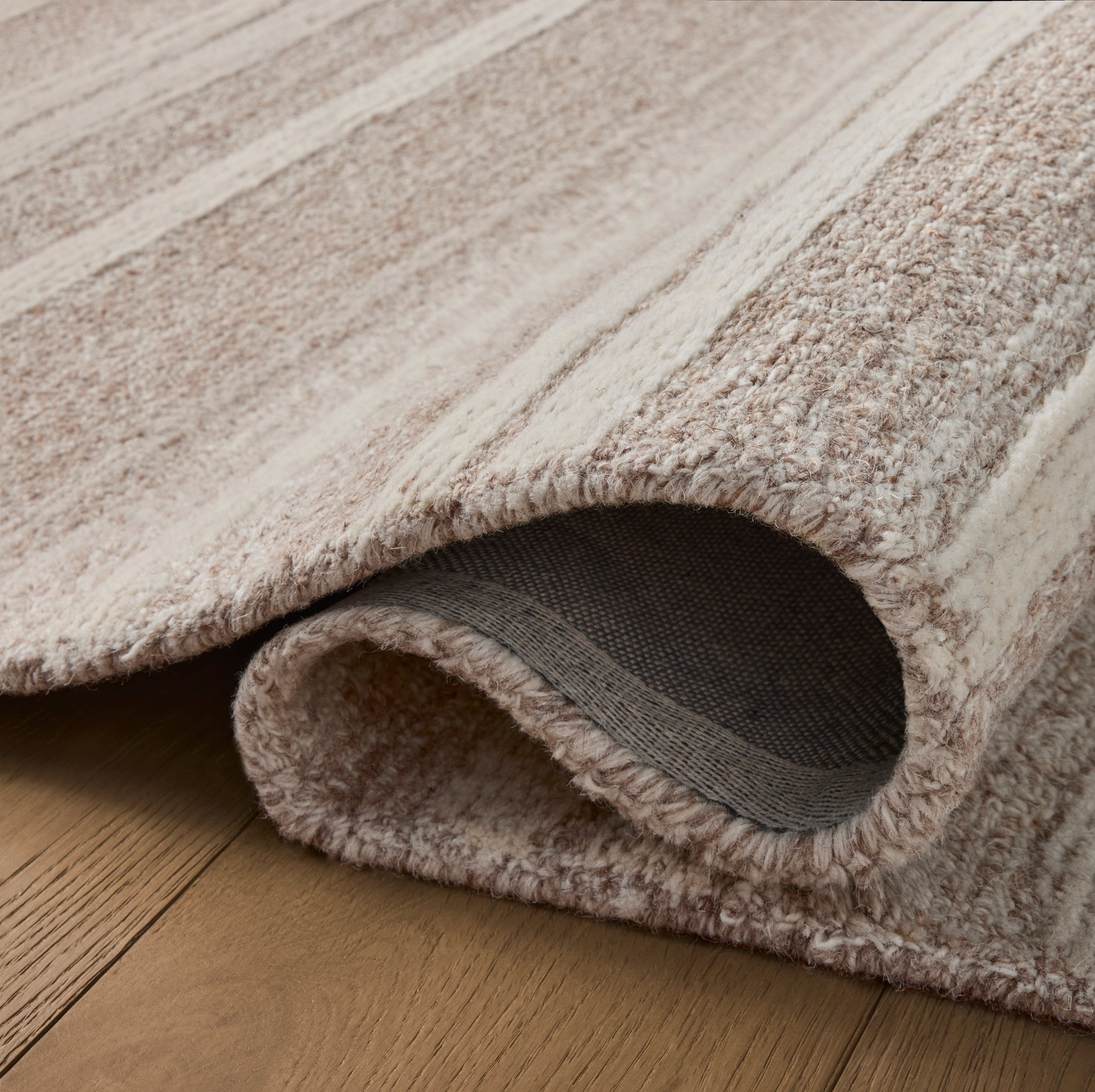 Rae Clay Ivory Rug close up of rolled rug
