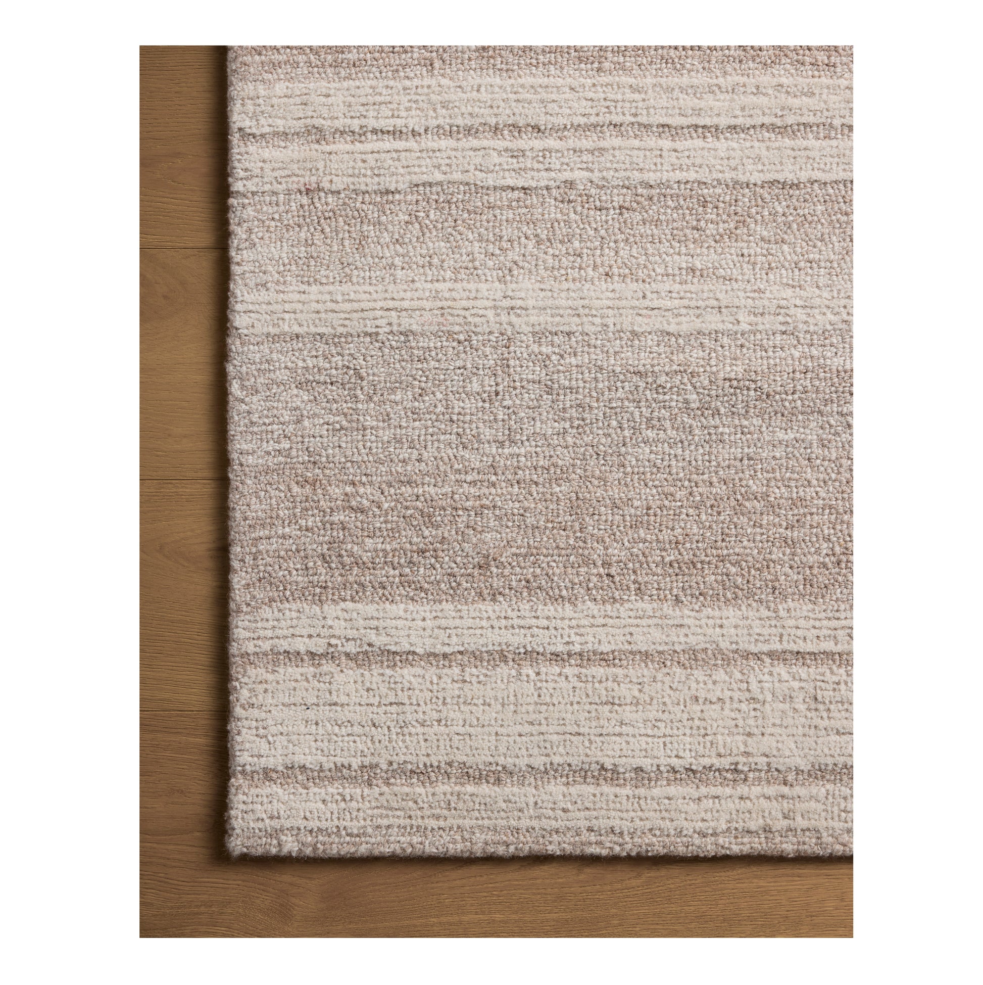 Rae Clay Ivory Rug close up of corner on wood floor