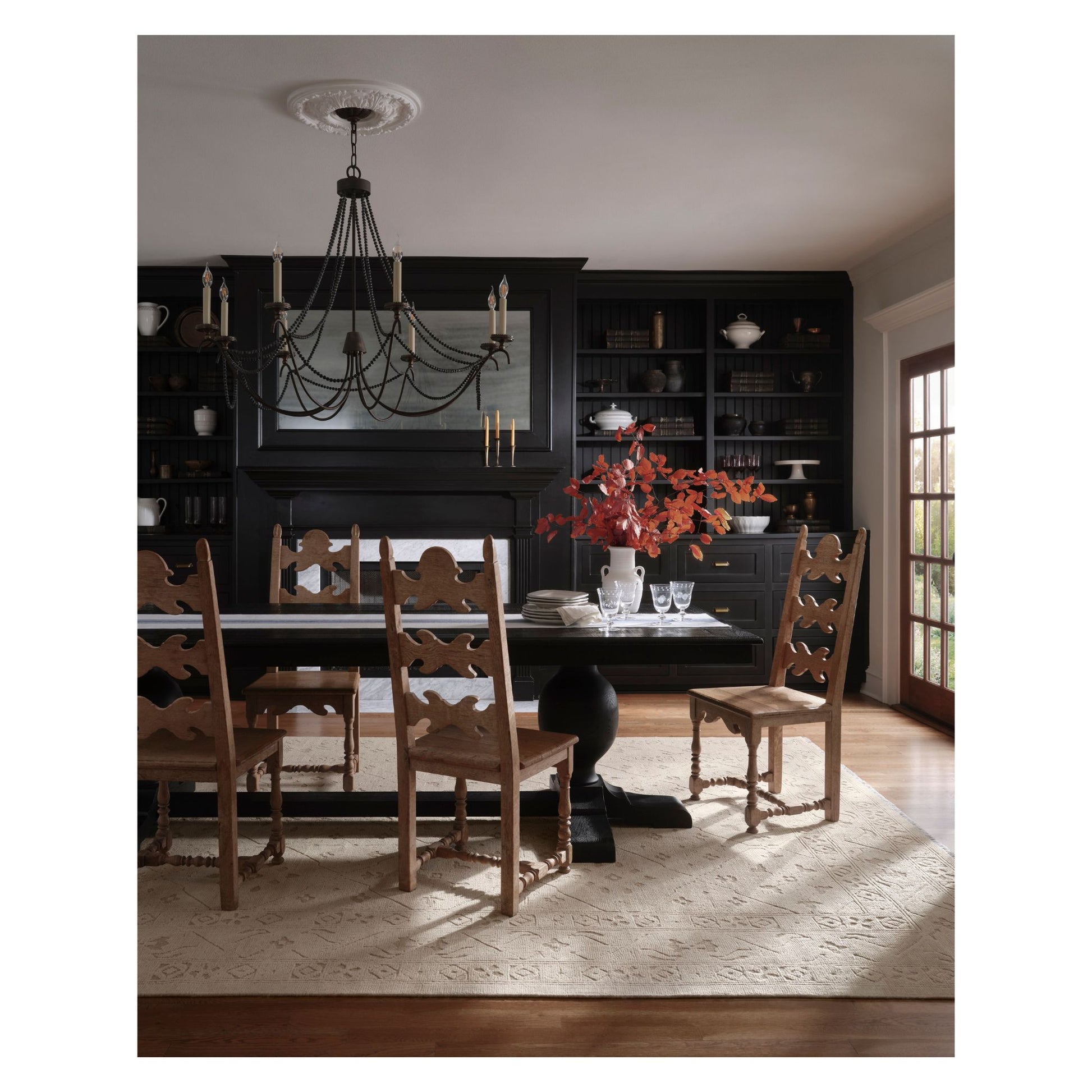Ruth Ivory Ivory Rug shown in dark dining room