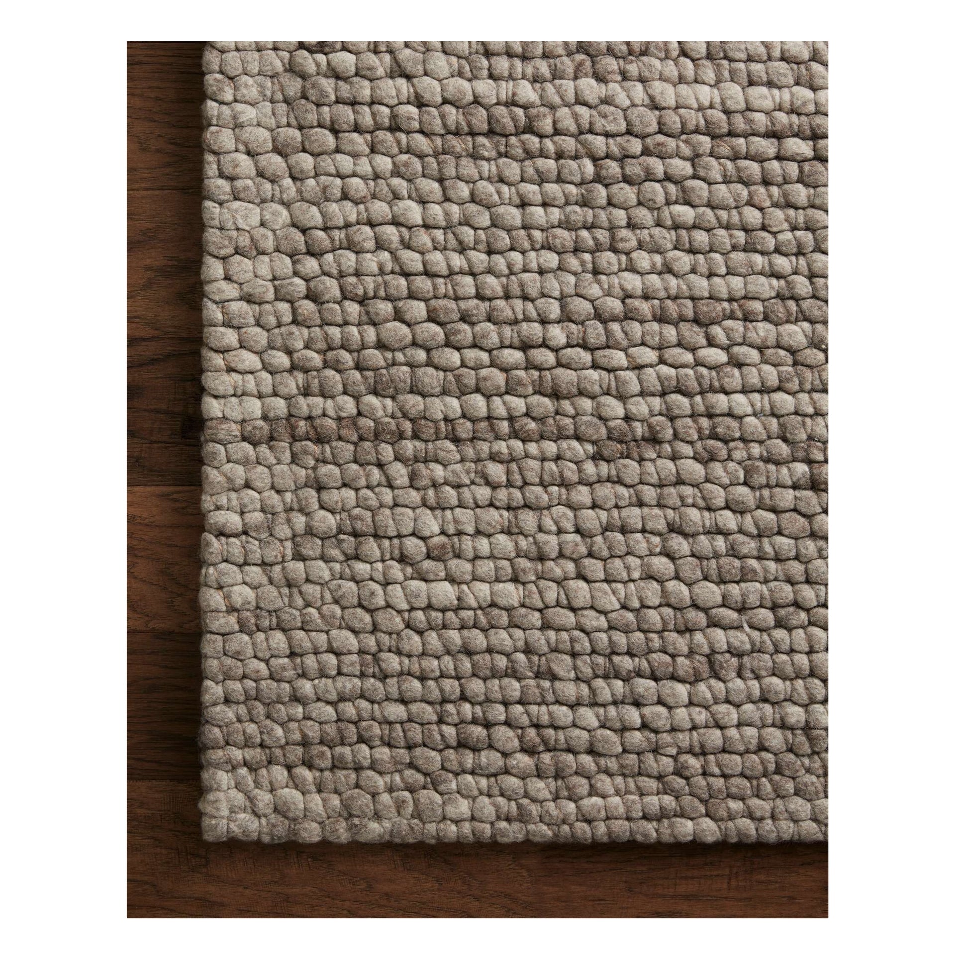 Caroline Granite Rug close up of corner on wood floor