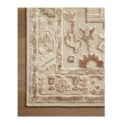Ingrid Ivory Earth Rug close up of corner on wood floor