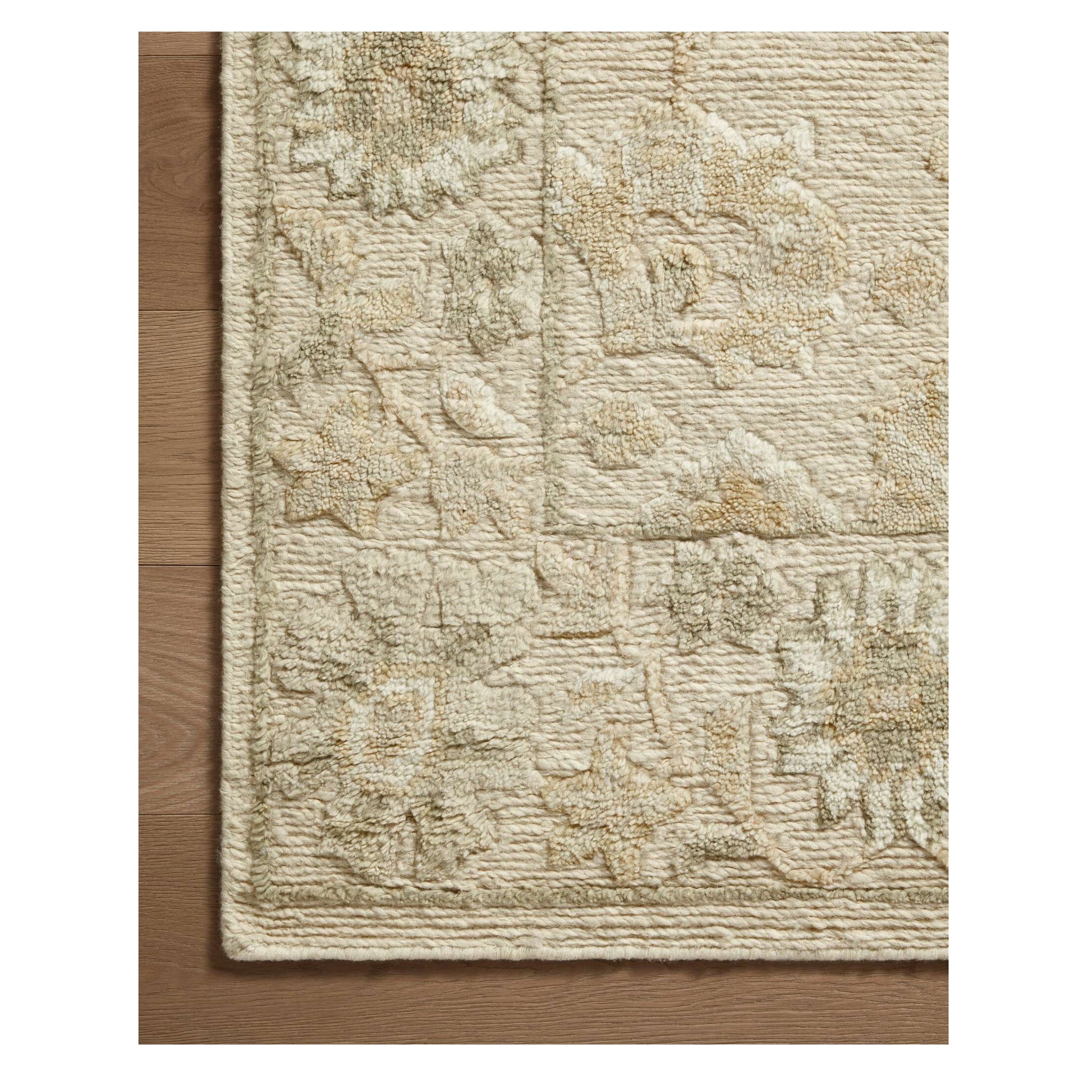 Ingrid Natural Sage Rug close up of corner of rug on wood floor