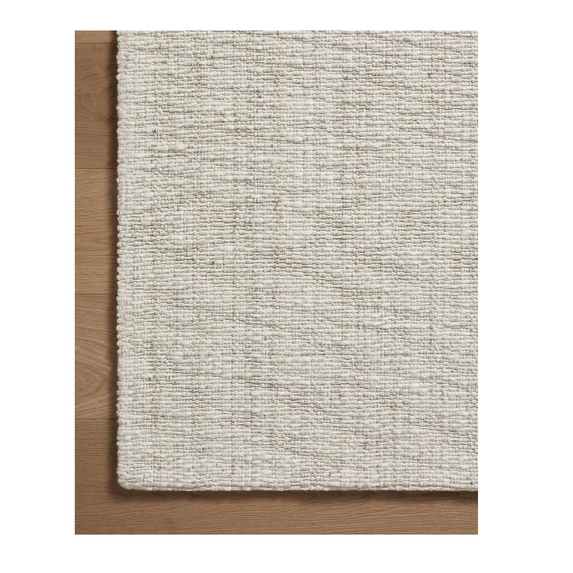 Pippa Fog Rug close up of corner on wood floor