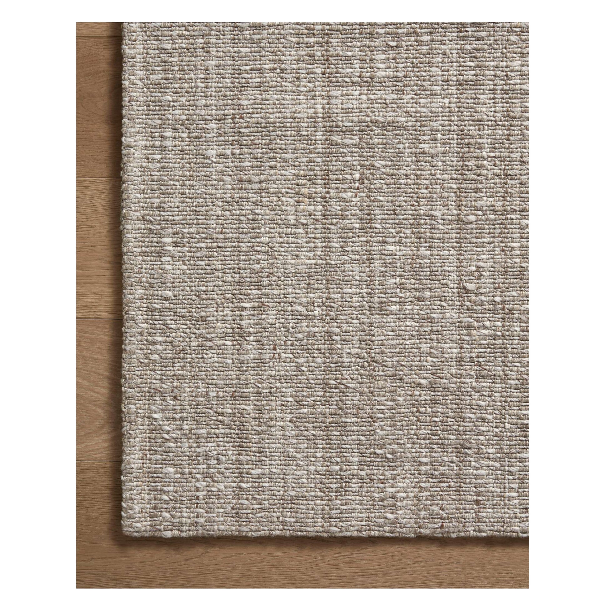 Pippa Stone Rug close up of corner on wood floor