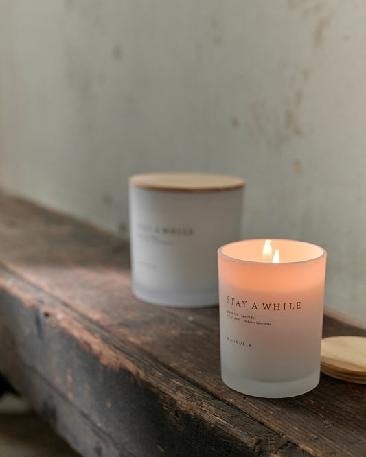 Magnolia Stay a While Candle lit up