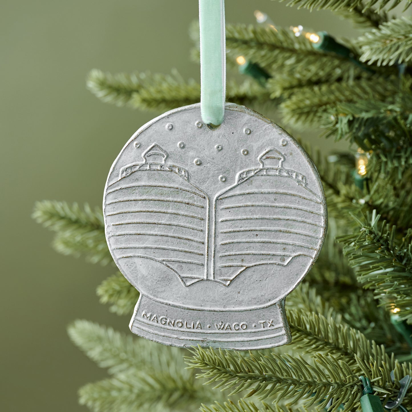 Silos Snow Globe Ceramic Ornament shown on tree