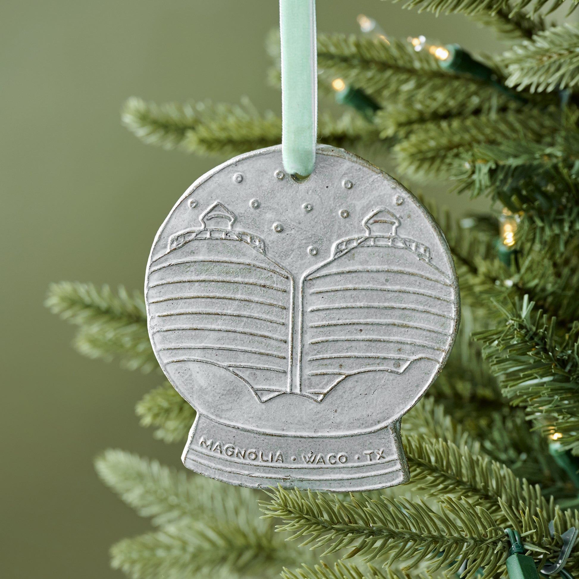 Silos Snow Globe Ceramic Ornament shown on tree