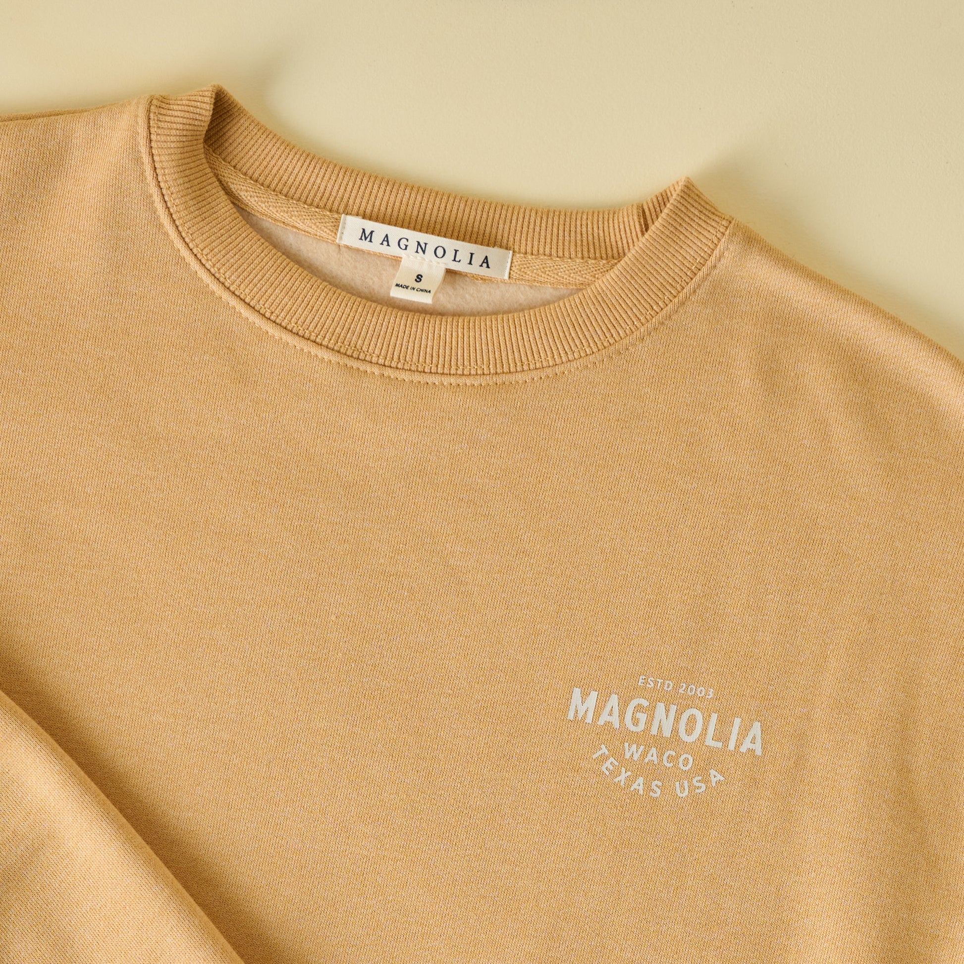 Magnolia Silos Modern Mustard Sweatshirt close up square logo