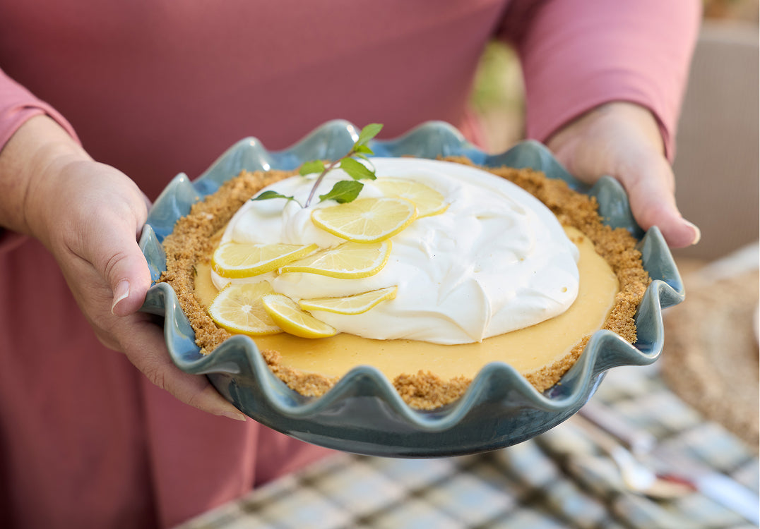 lemon pie in a blue scalloped pie dish