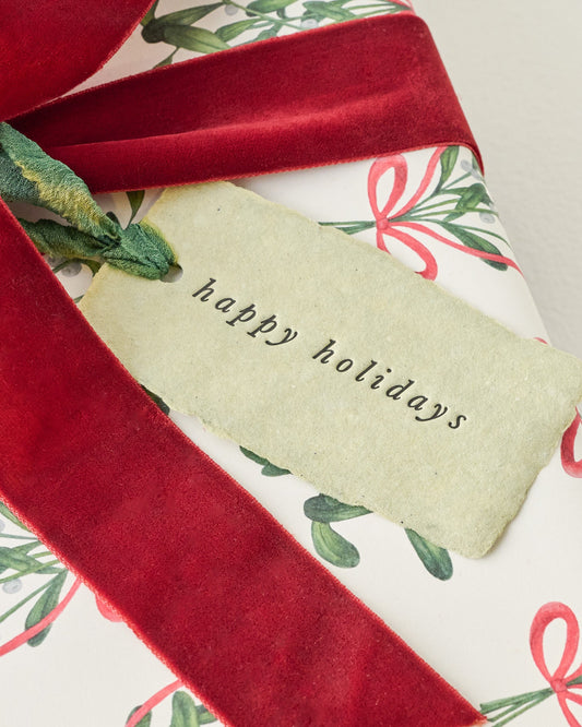 Happy Holidays Gift Tag shown on gift