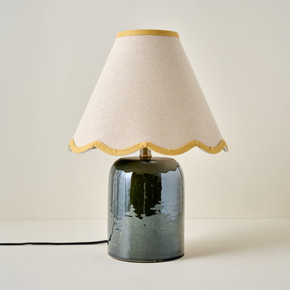 Farrah Table Lamp - Textured Green shown with mustard yellow wavy lamp shade