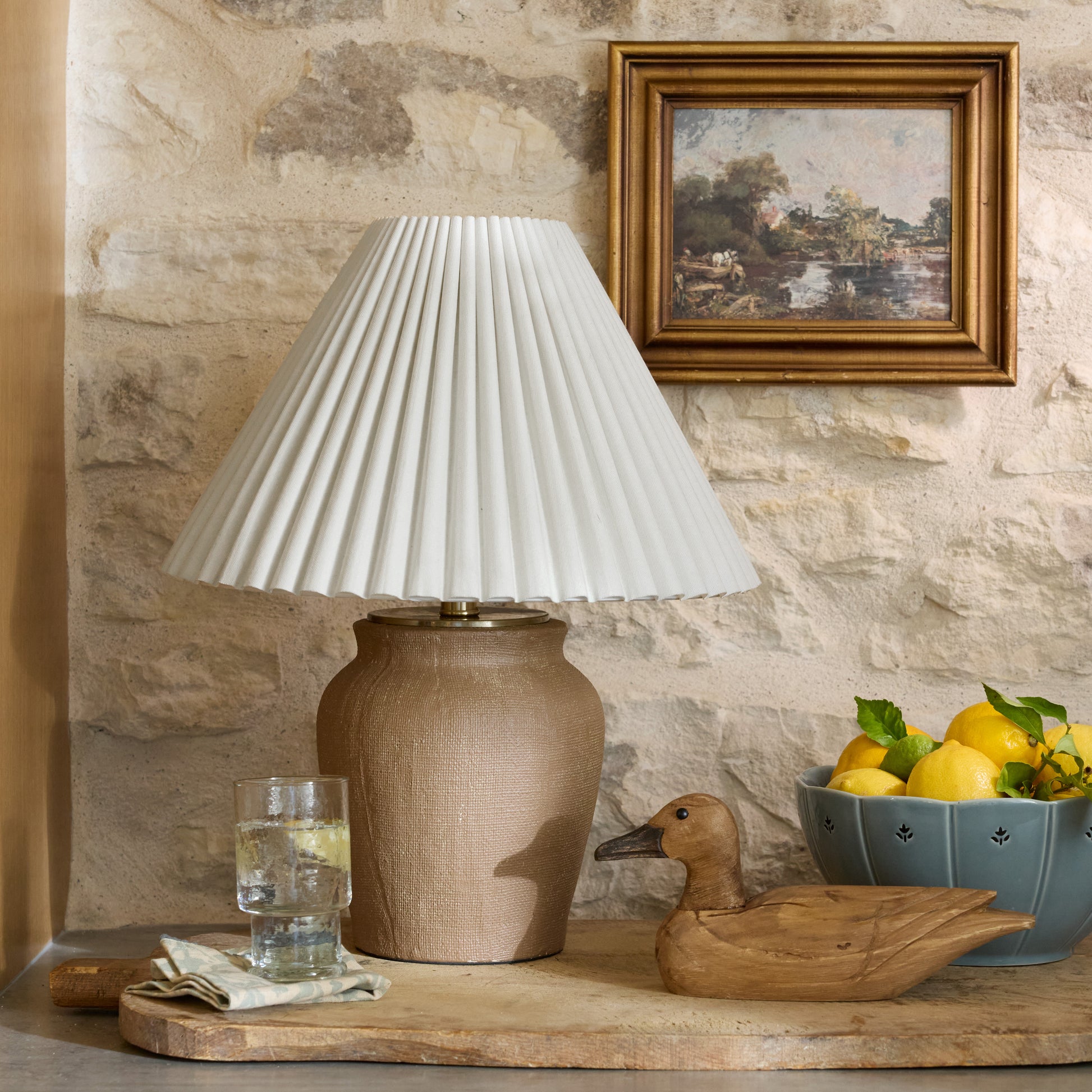 Teddie Table Lamp in Empire Scallop sitting in a room with decorative accessories