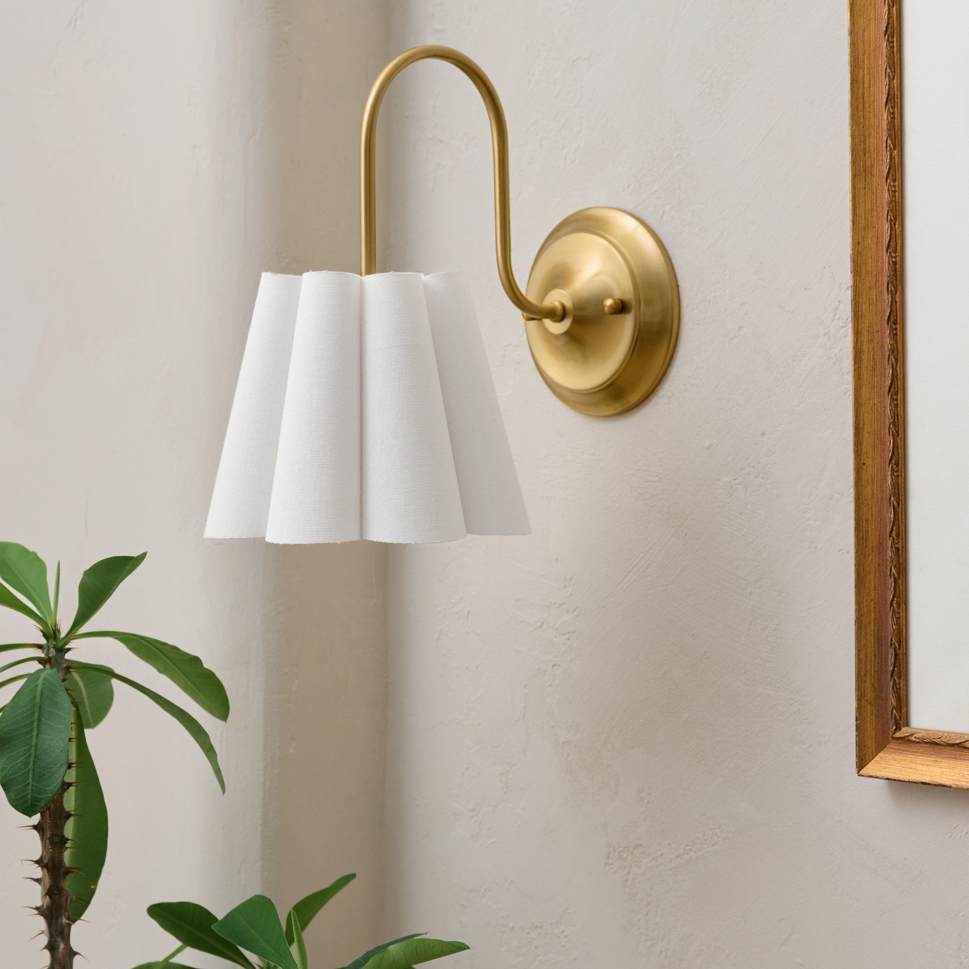 Fluted Scallop Hardwired Wall Sconce in a room