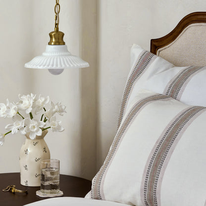 Marjorie Milk Glass Pendant (Small) in bedroom over end table with floral vase