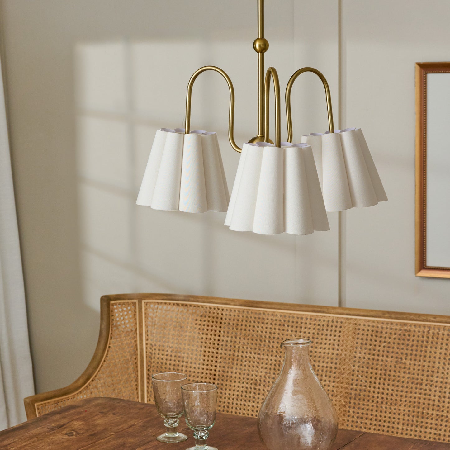 Fluted Scallop Chandelier in a room over dining table