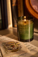 Magnolia Twelve Nights Candle - Limited Edition on surface with cards

